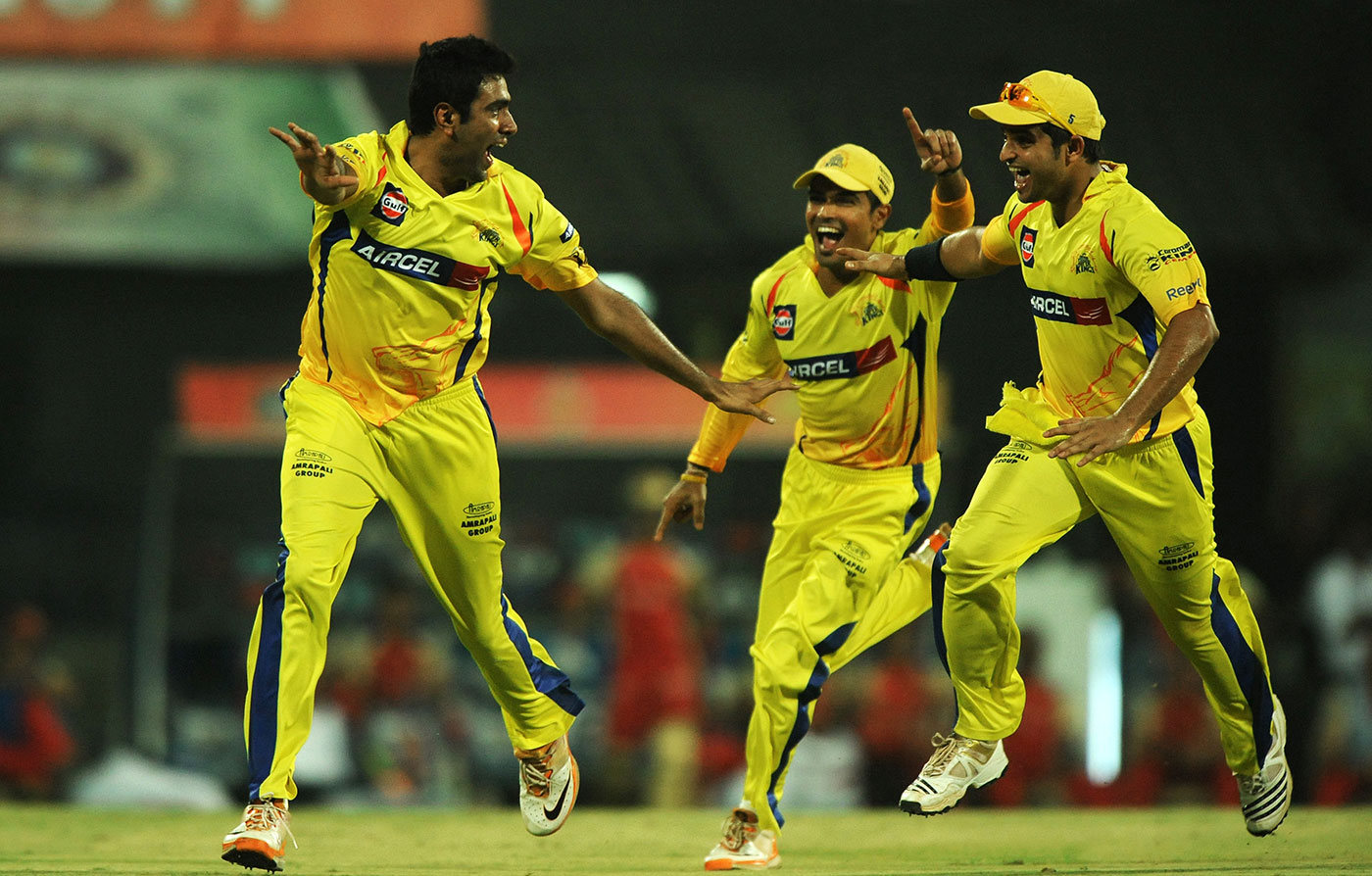 R Ashwin is about to be mobbed after dismissing Chris Gayle
