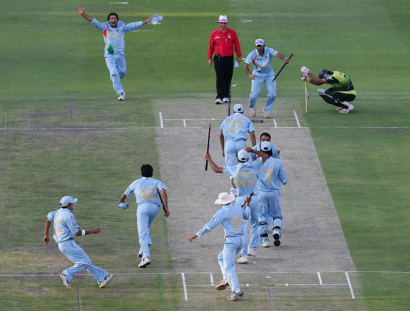 The winning moment - Misbah-ul-Haq rues his luck as the Indians celebrate
