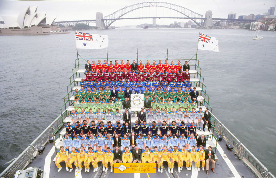 The nine teams and officials line up for photos on a ship in Sydney Harbour