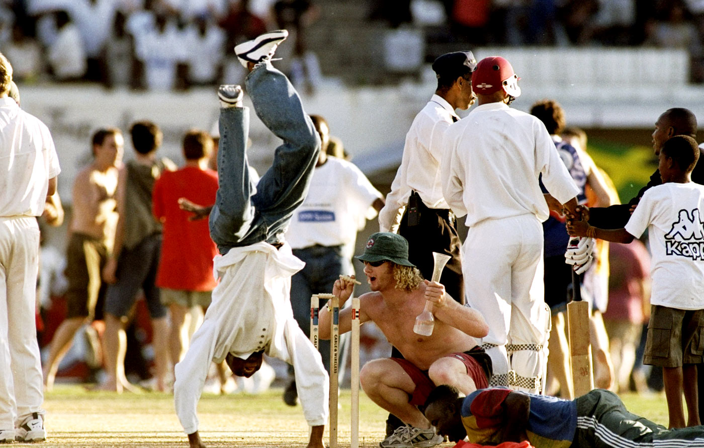 Witness to the resurrection: fans invade the pitch after Lara's double-century