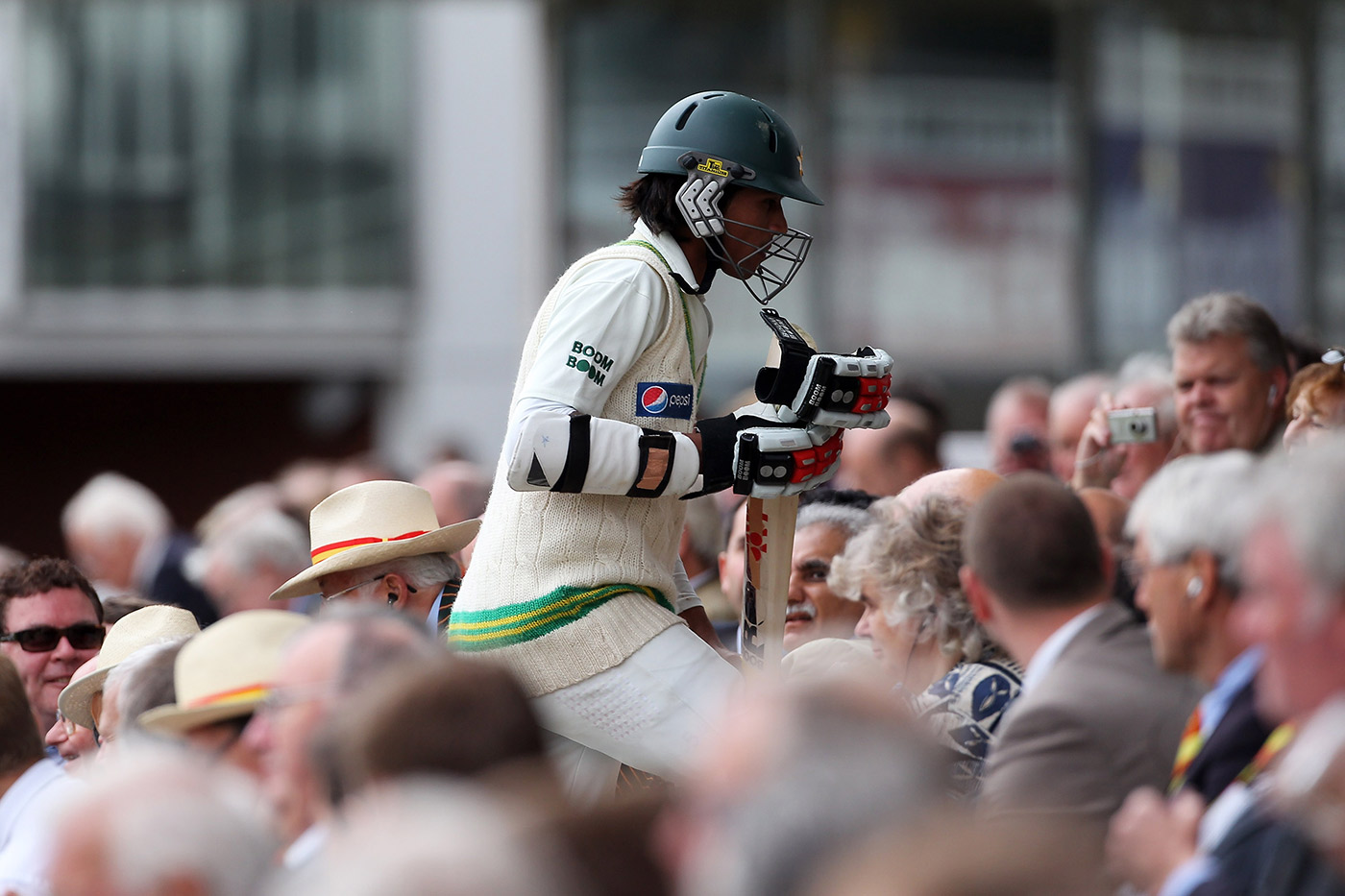 Amir walks back after his dismissal on day four of the Test: without him (and Asif), cricket has been poorer and richer