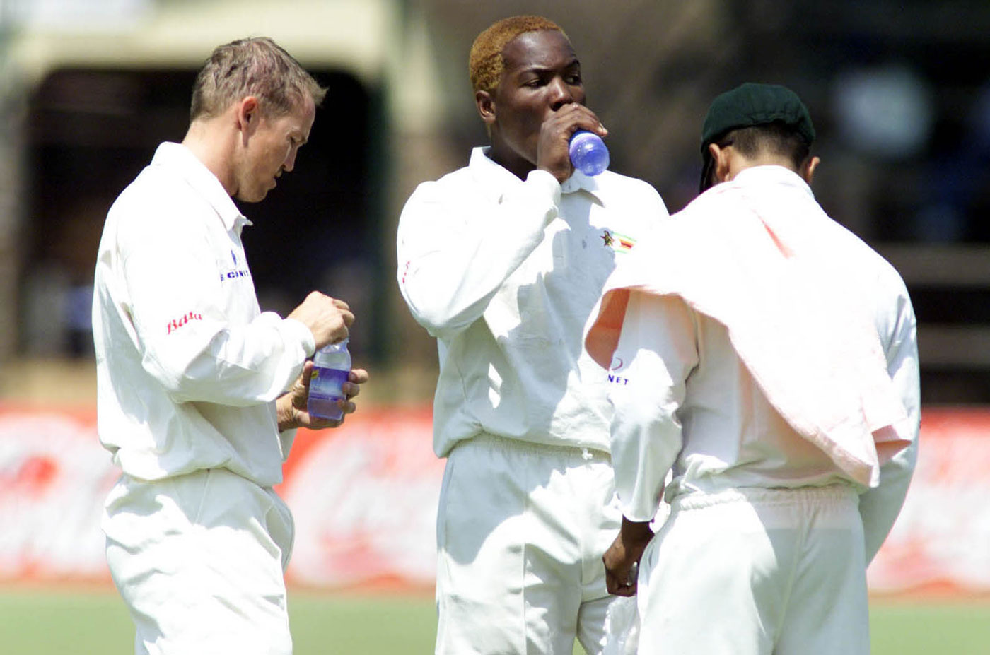 When Andy Flower (left, next to Hamilton Masakadza) moved to Takashinga, a black club, it inspired more Zimbabweans to sign up for the game