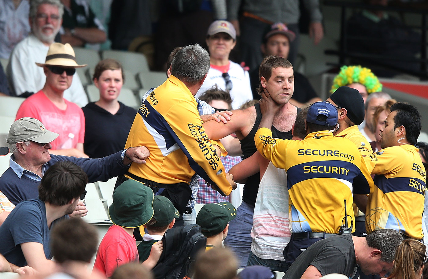 Why should football fans have a monopoly on in-stadium argy bargy with security staff? A spectator is ejected during the 2012 MCG Test