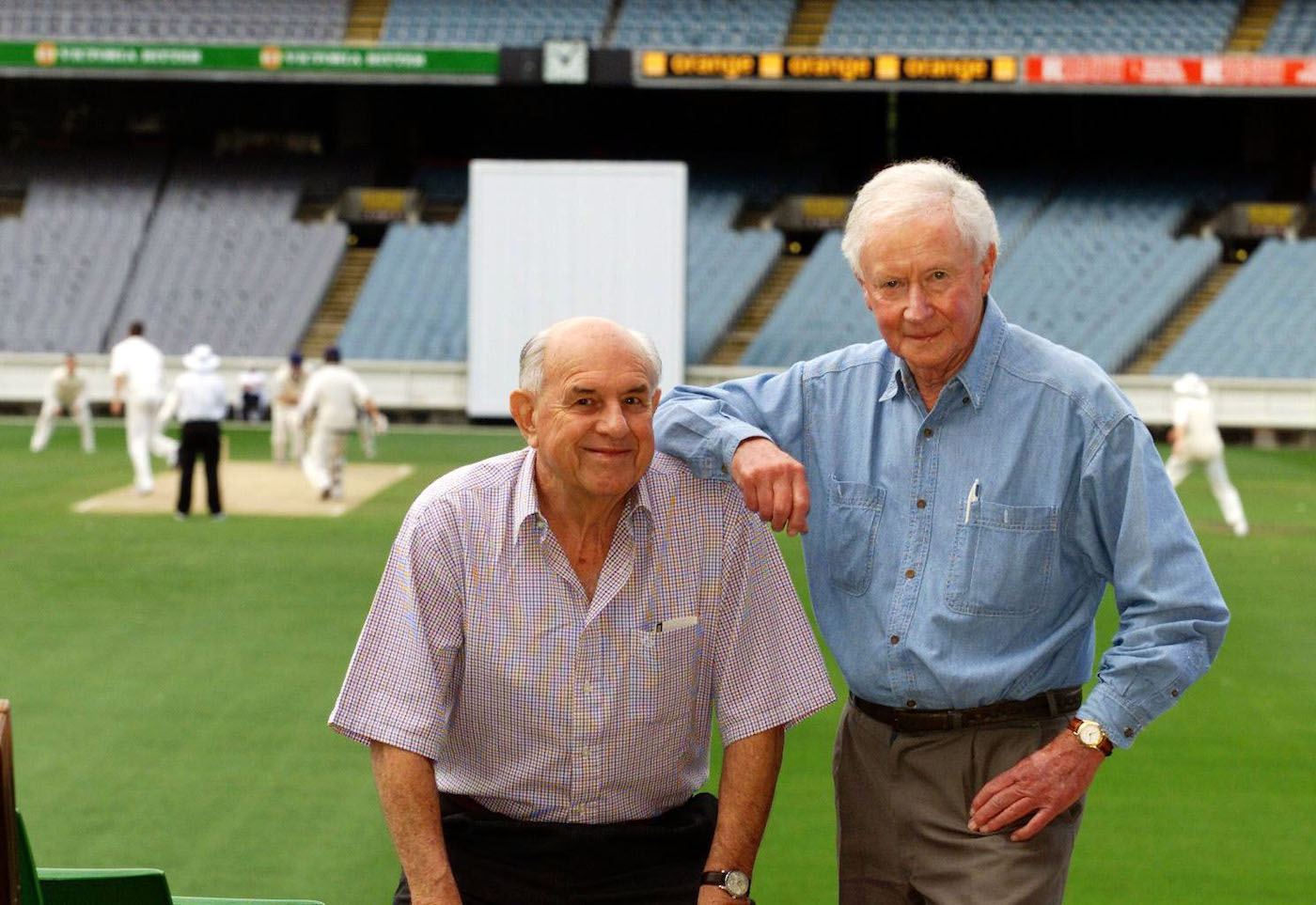 George Thoms, right, with former team-mate Colin McDonald in 2002