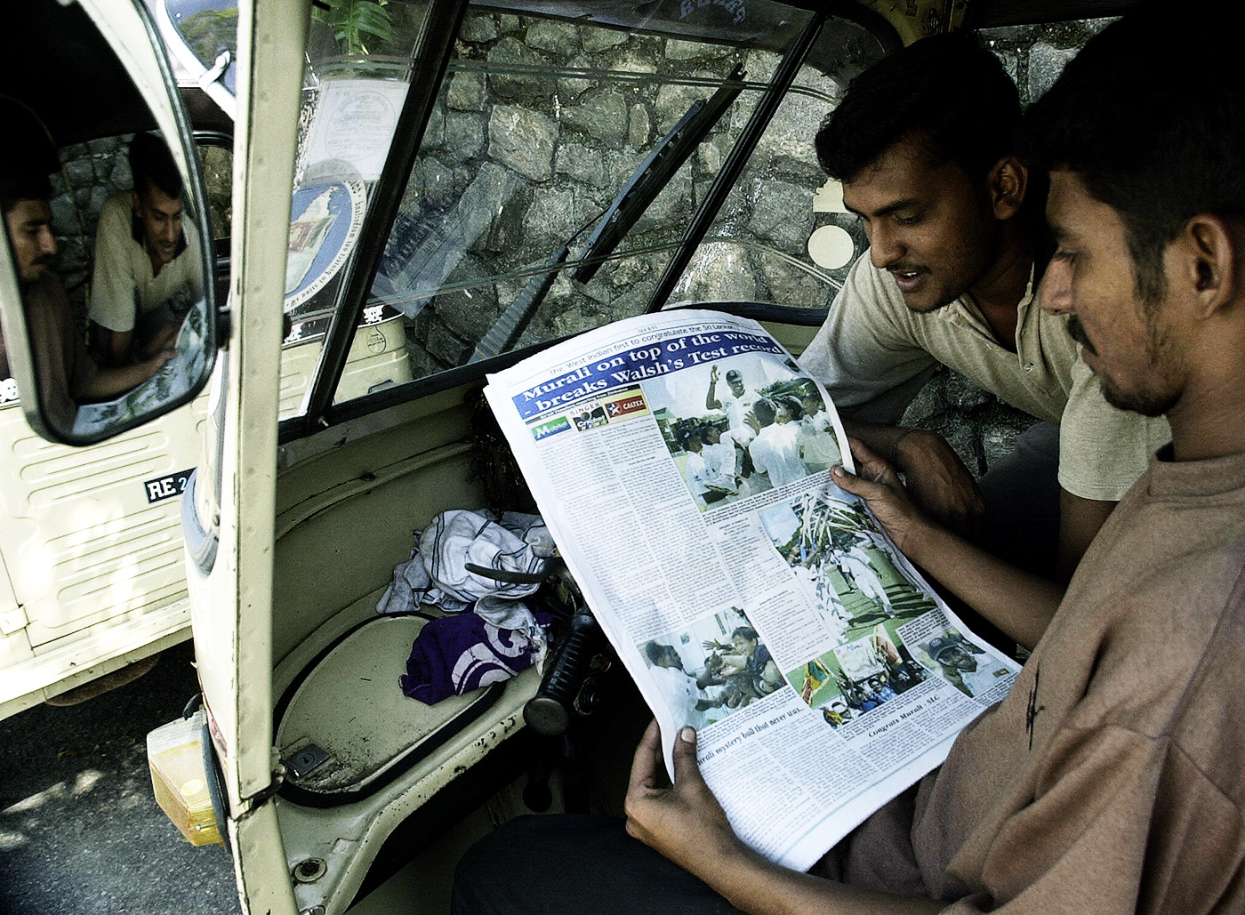 Walsh is history: fans read about Murali taking the title of world record holder for most Test wickets, in 2004