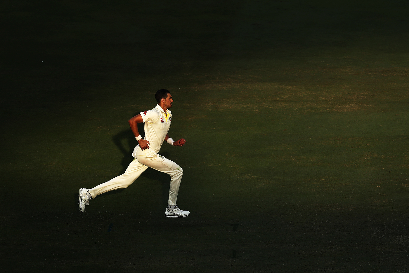 Mitchell Starc runs in to bowl