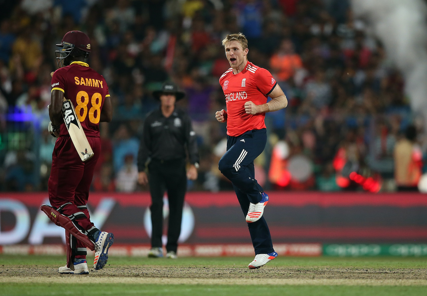 Trip like I do: Darren Sammy gets danced off the field by David Willey, 