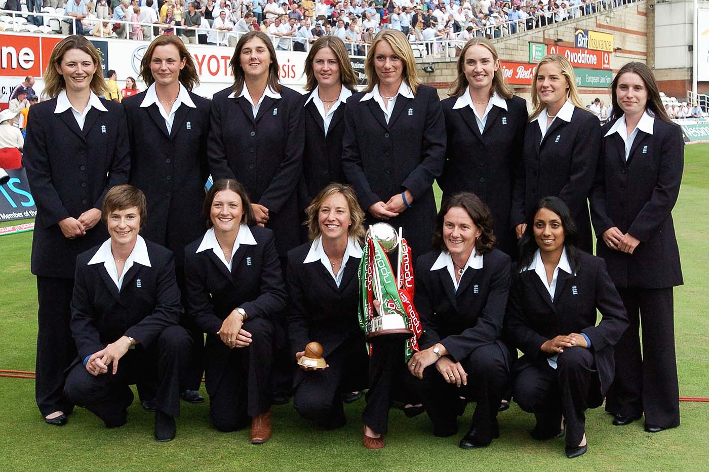 The England women's squad poses with the Ashes trophy