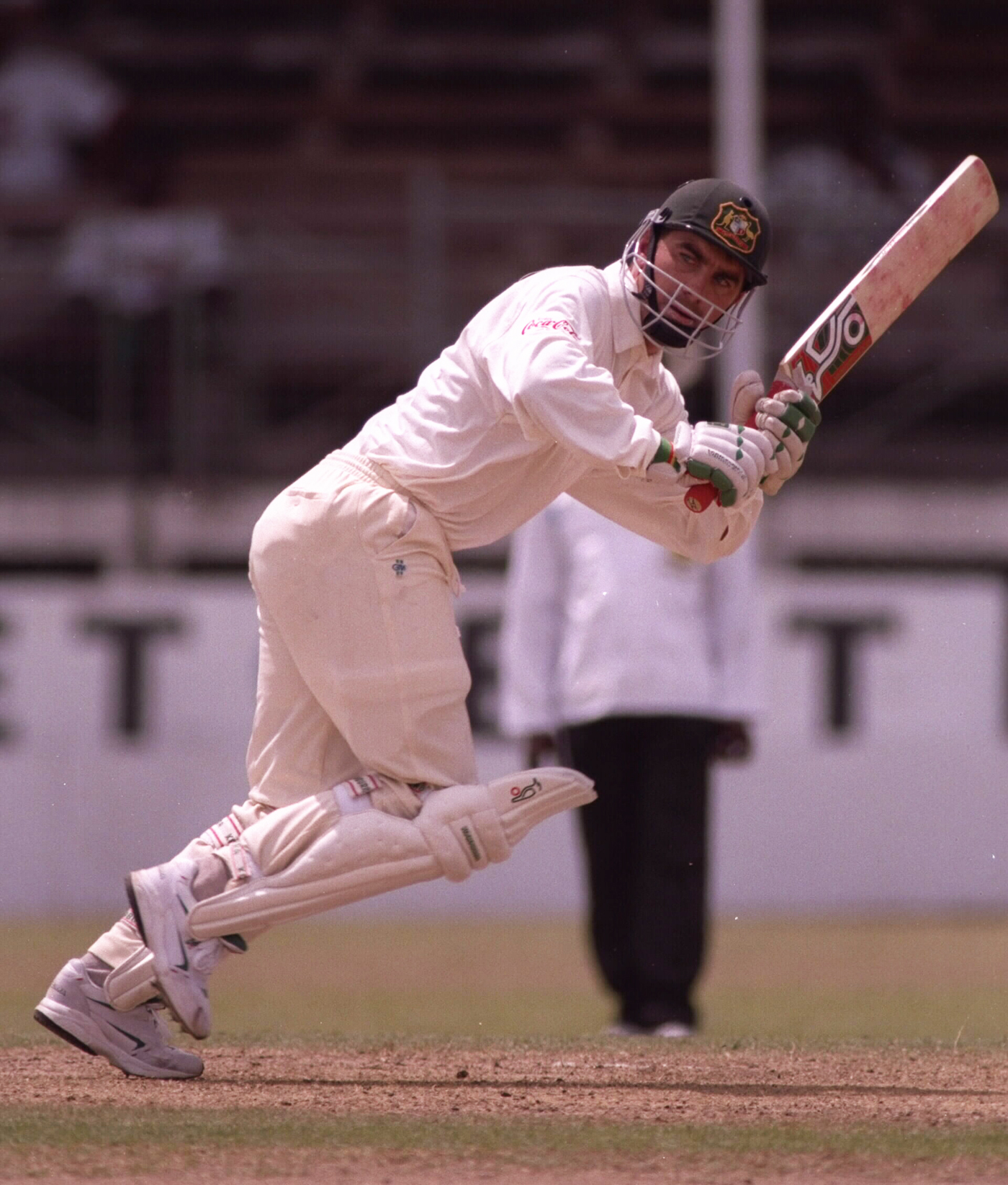 Justin Langer had a fiery debut, getting hit on the head by West Indies' bowlers (and also his own captain, Allan Border) but still making a fighting half-century in the chase