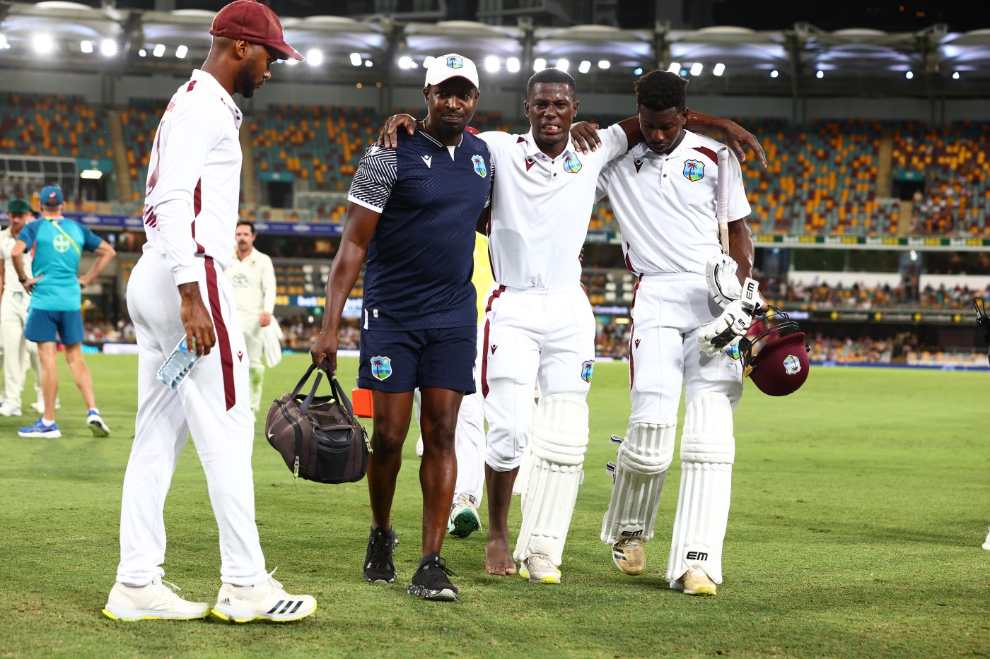 The agony before the ecstasy: Joseph hobbles off the field after having his toe crushed by a yorker on day three in Brisbane