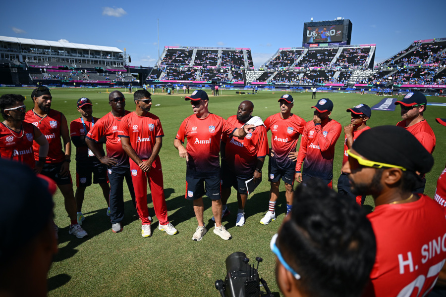 USA coach Stuart Law addresses the side before their match against India