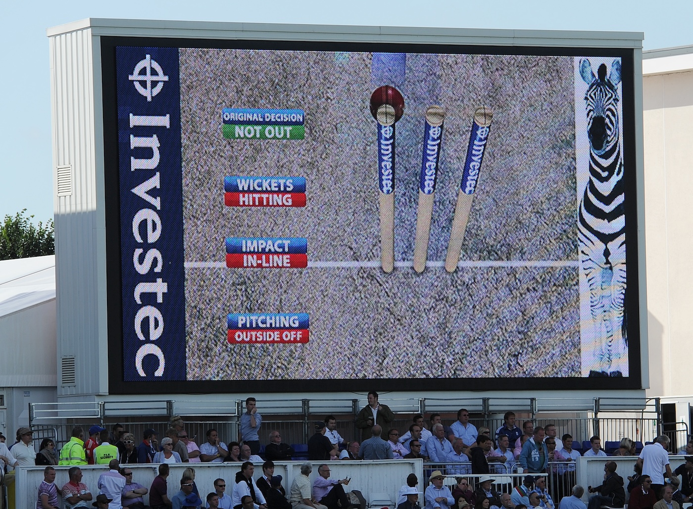 The big screen shows a Hawk-Eye graphic