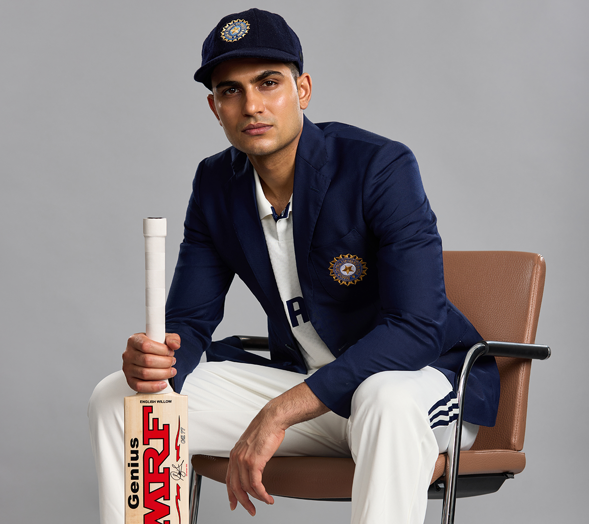 Shubman Gill poses with a bat